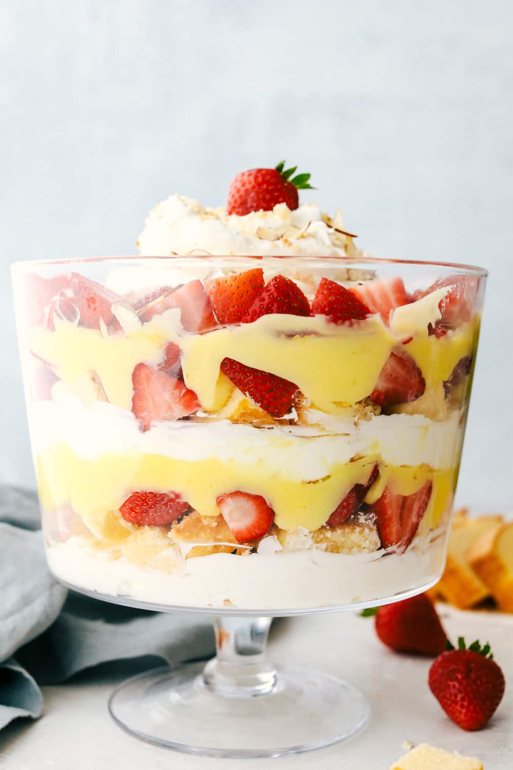 The English trifle in a tall glass dish layered together. 