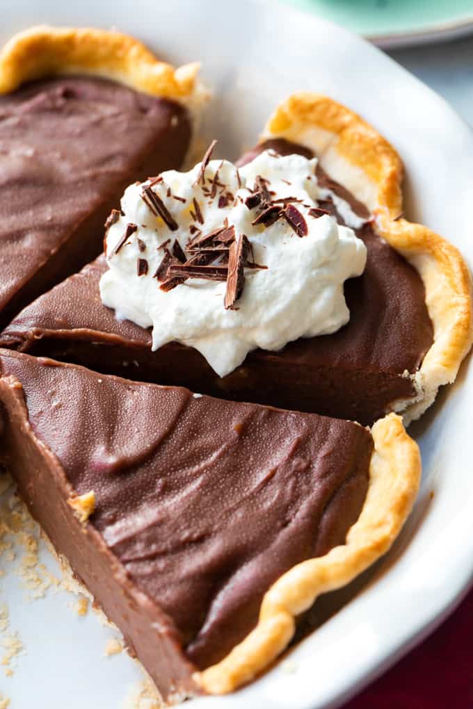 Chocolate pie sliced in a pie plate. 