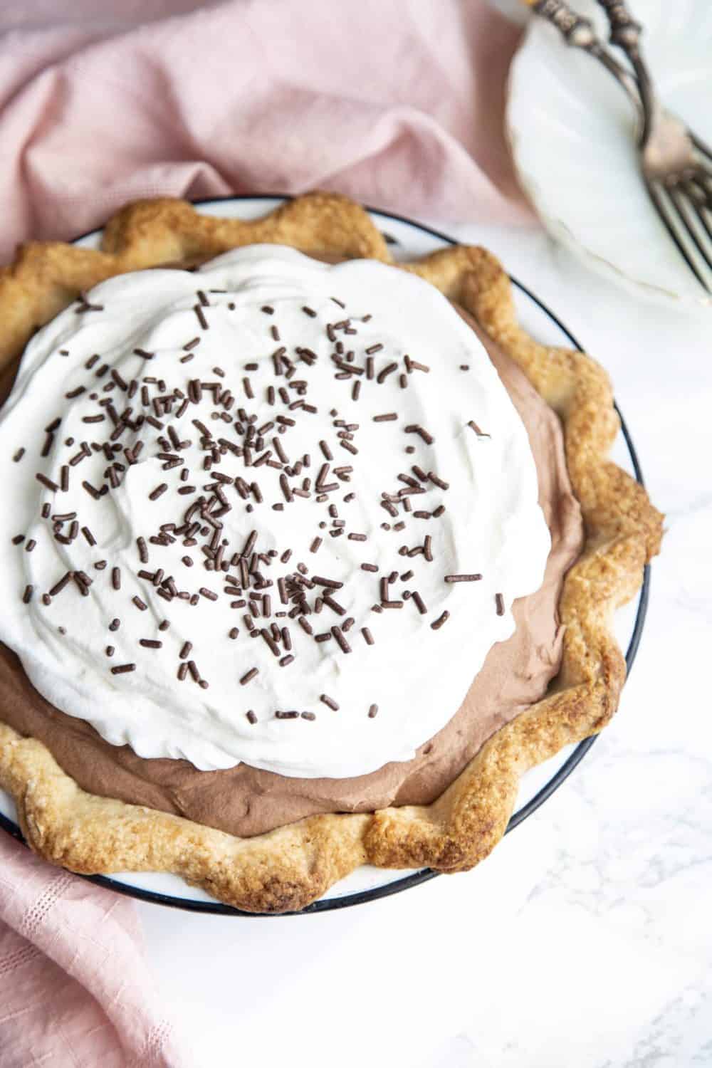 French Silk pie with whipped topping and chocolate sprinkles.