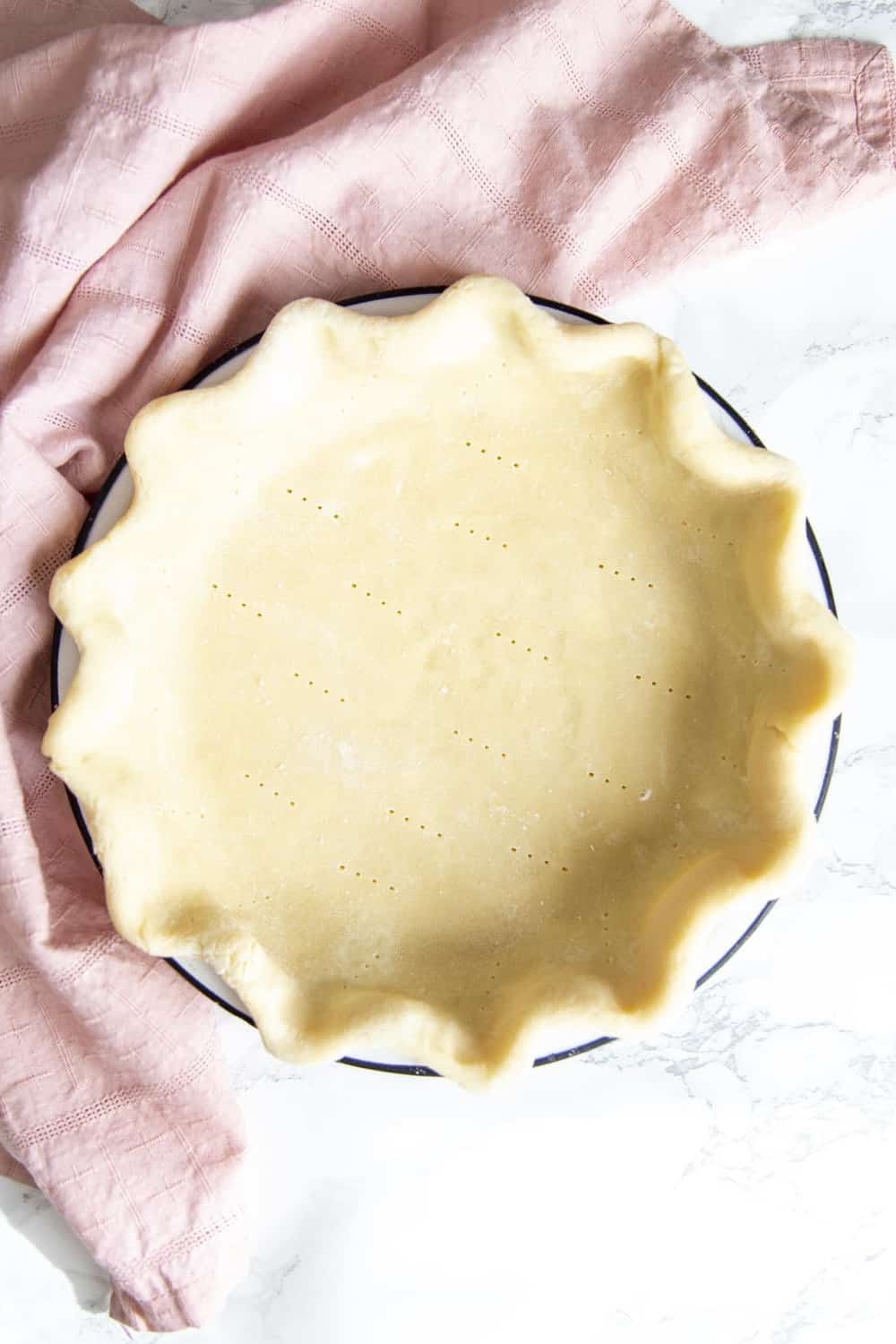 Pie Crust in a pie plate ready for baking.