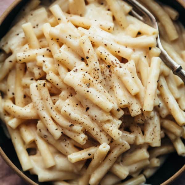 Instant pot mac and cheese served in a bowl with a fork