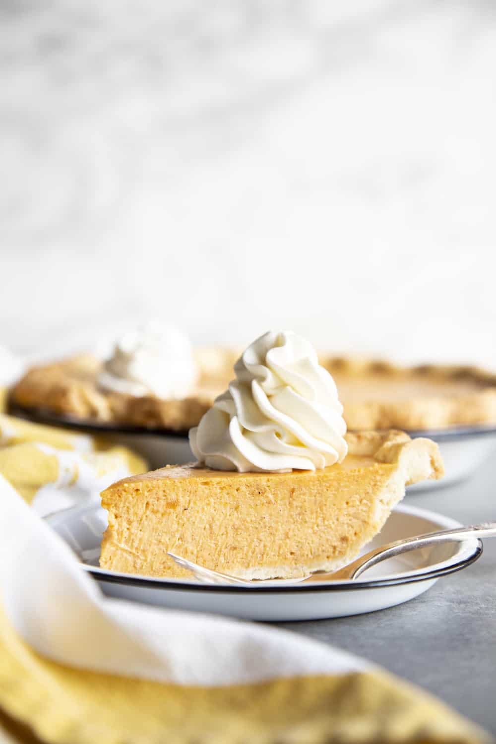 A slice of sweet potato pie on a plate