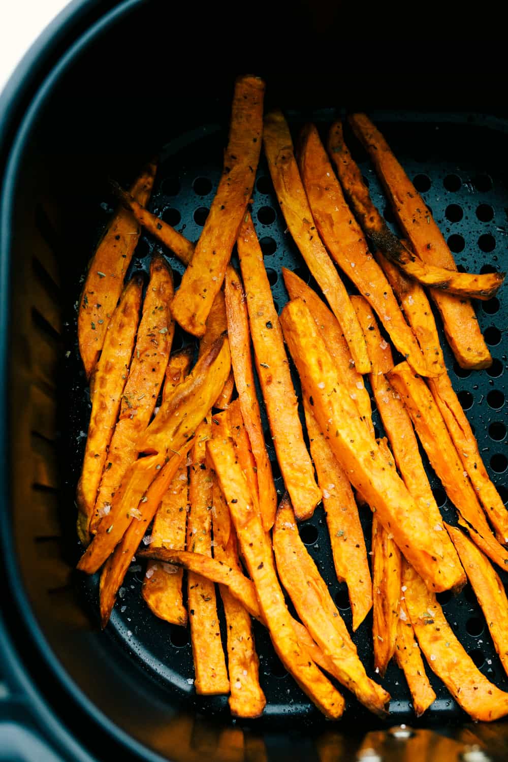 Sweet potato air fryer fries with seasonings.