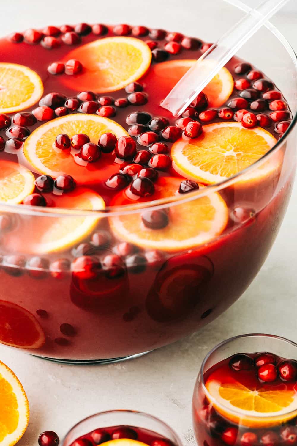 Christmas punch with cranberries and orange slices.