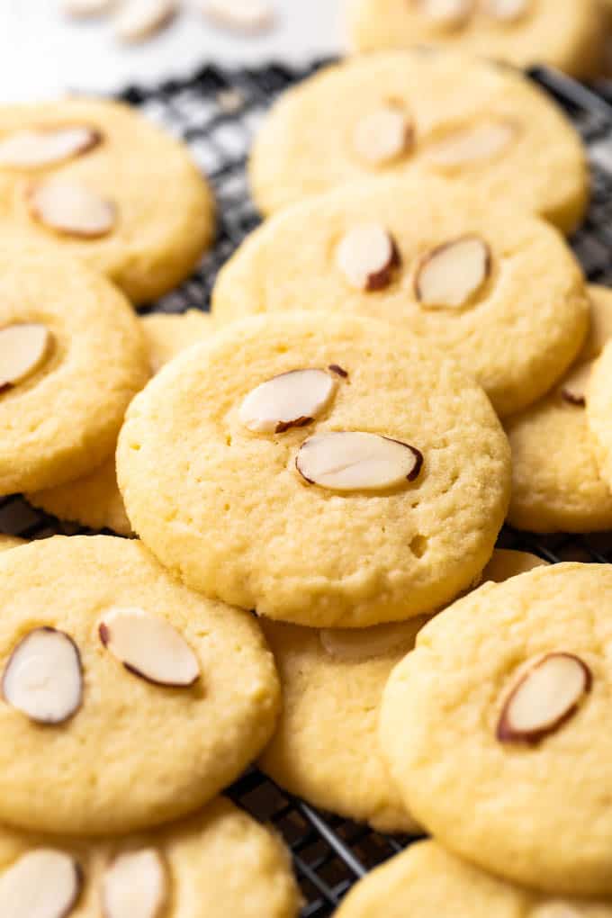 Almond cookies on a cookie rack. 