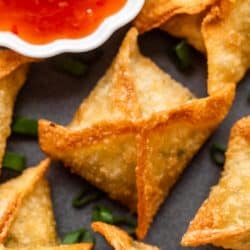 Closeup of a piece of crab rangoon on a plate