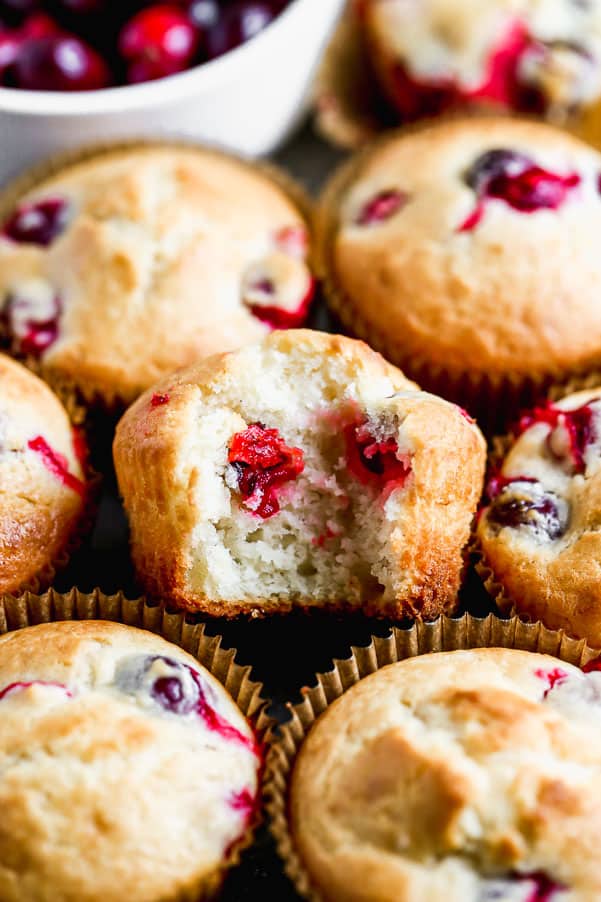 Cranberry muffins stacked together.