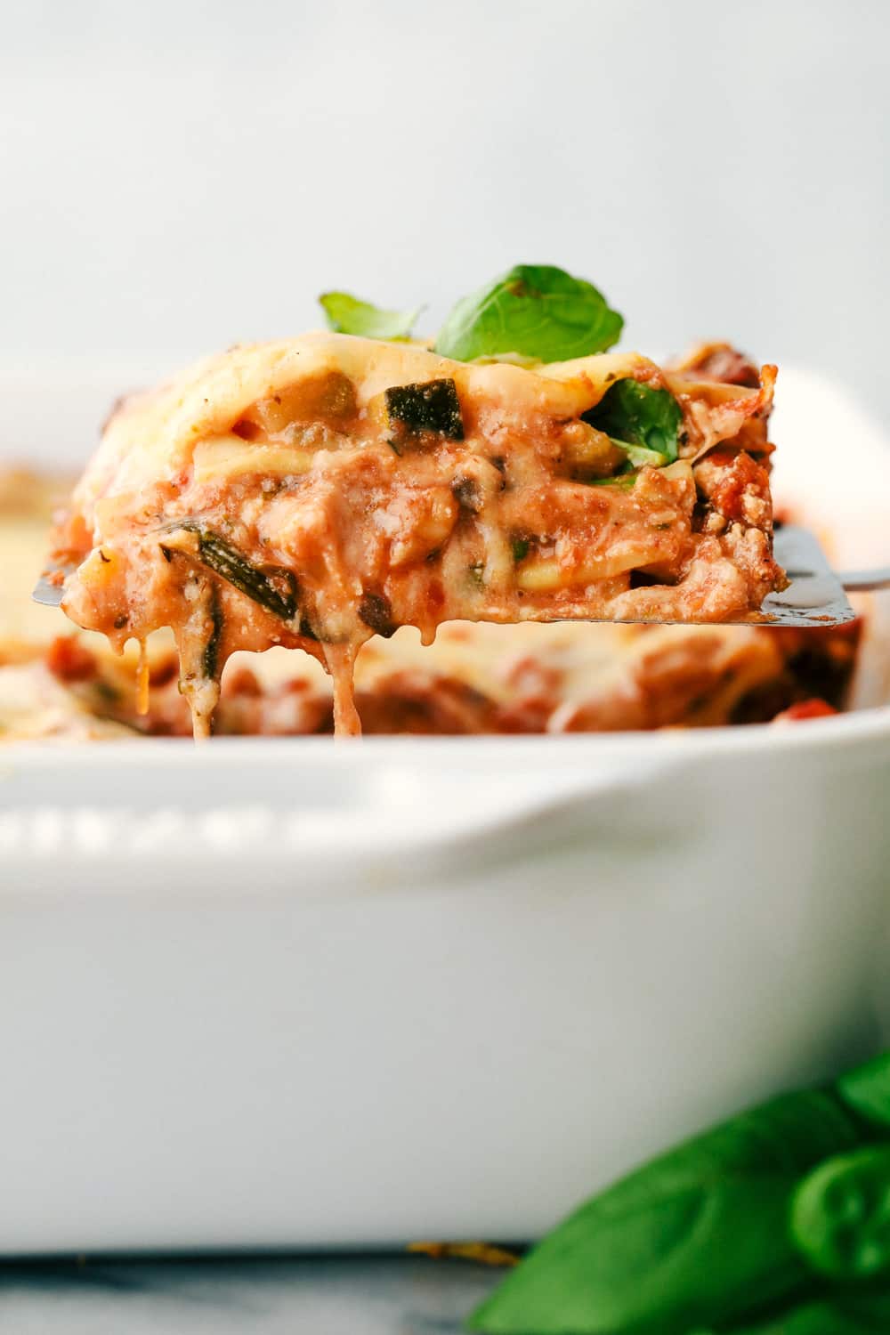 Vegetable Lasagna being scooped out of the dish.