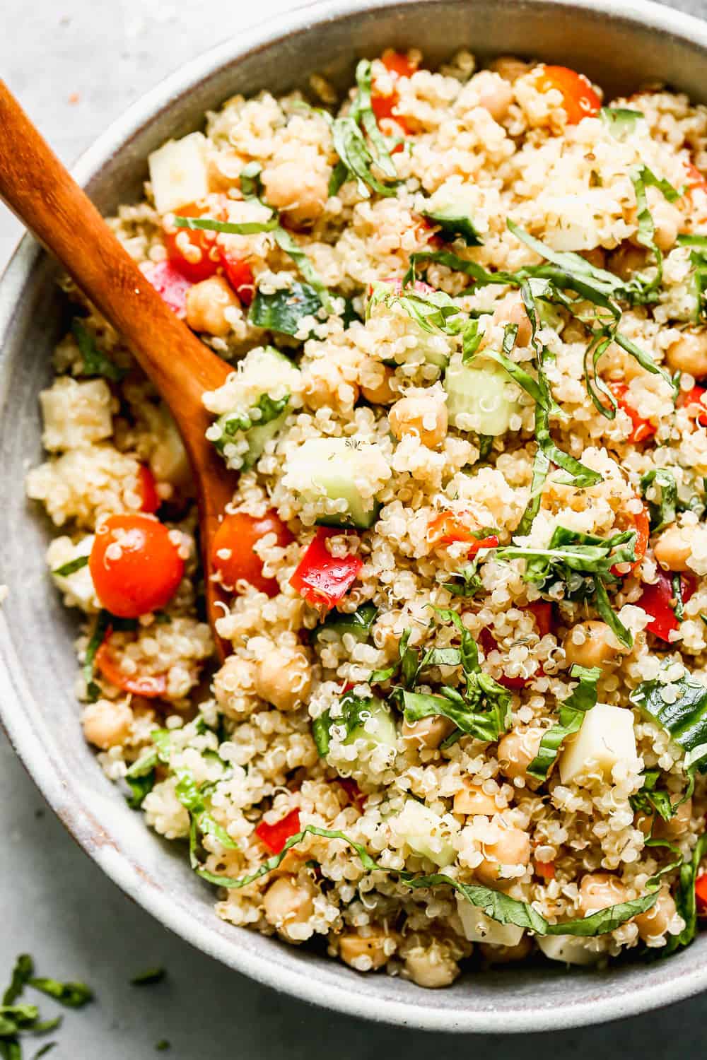 Packed with fuffy quinoa, crisp veggies, chickpeas, salty provolone cheese, and a zesty lemon vinaigrette, this easy Quinoa Salad is the perfect lunch on its own, or base for chicken, salmon or steak for dinner. 30 minutes and done!