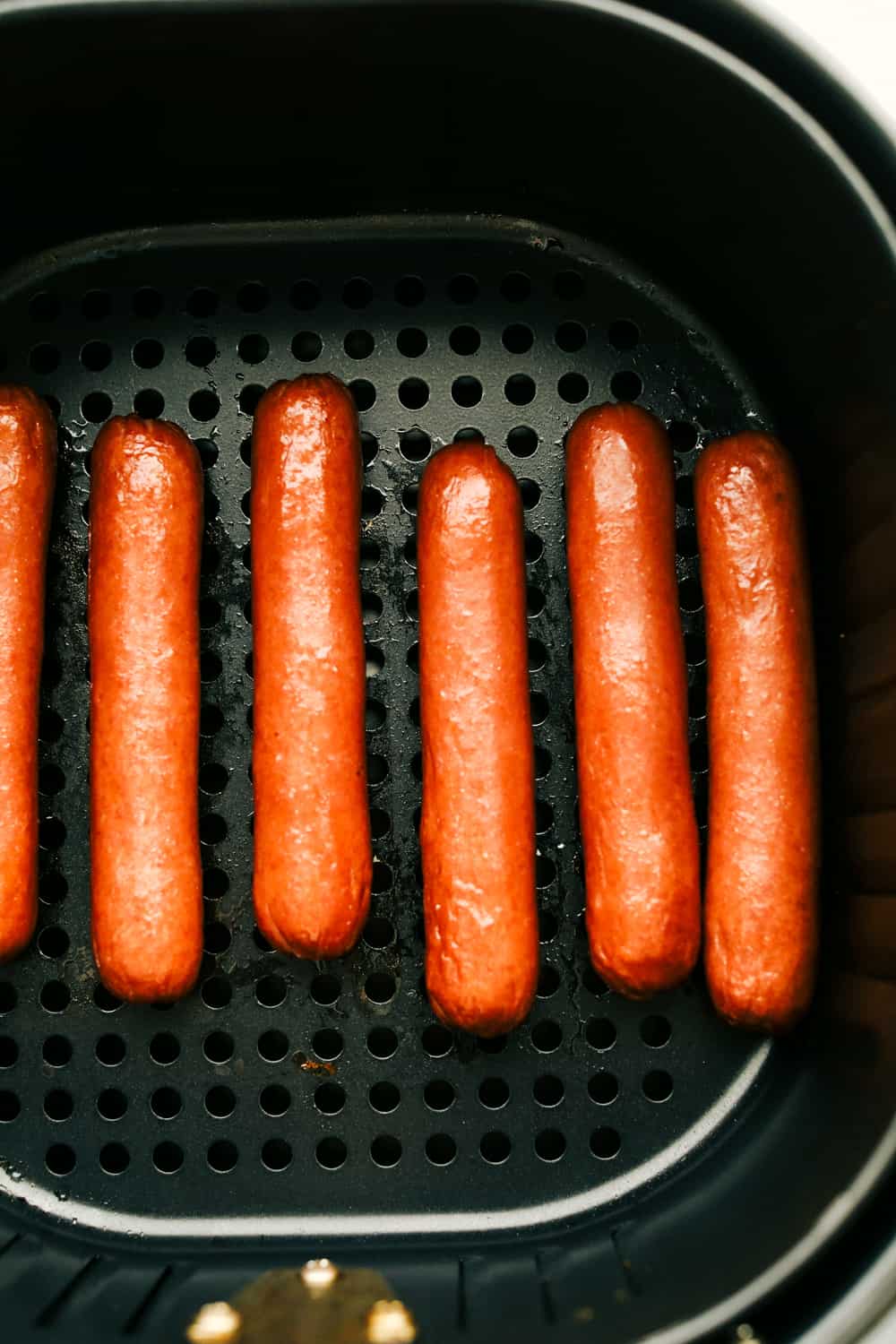 Up close picture of cooked hot dogs. 