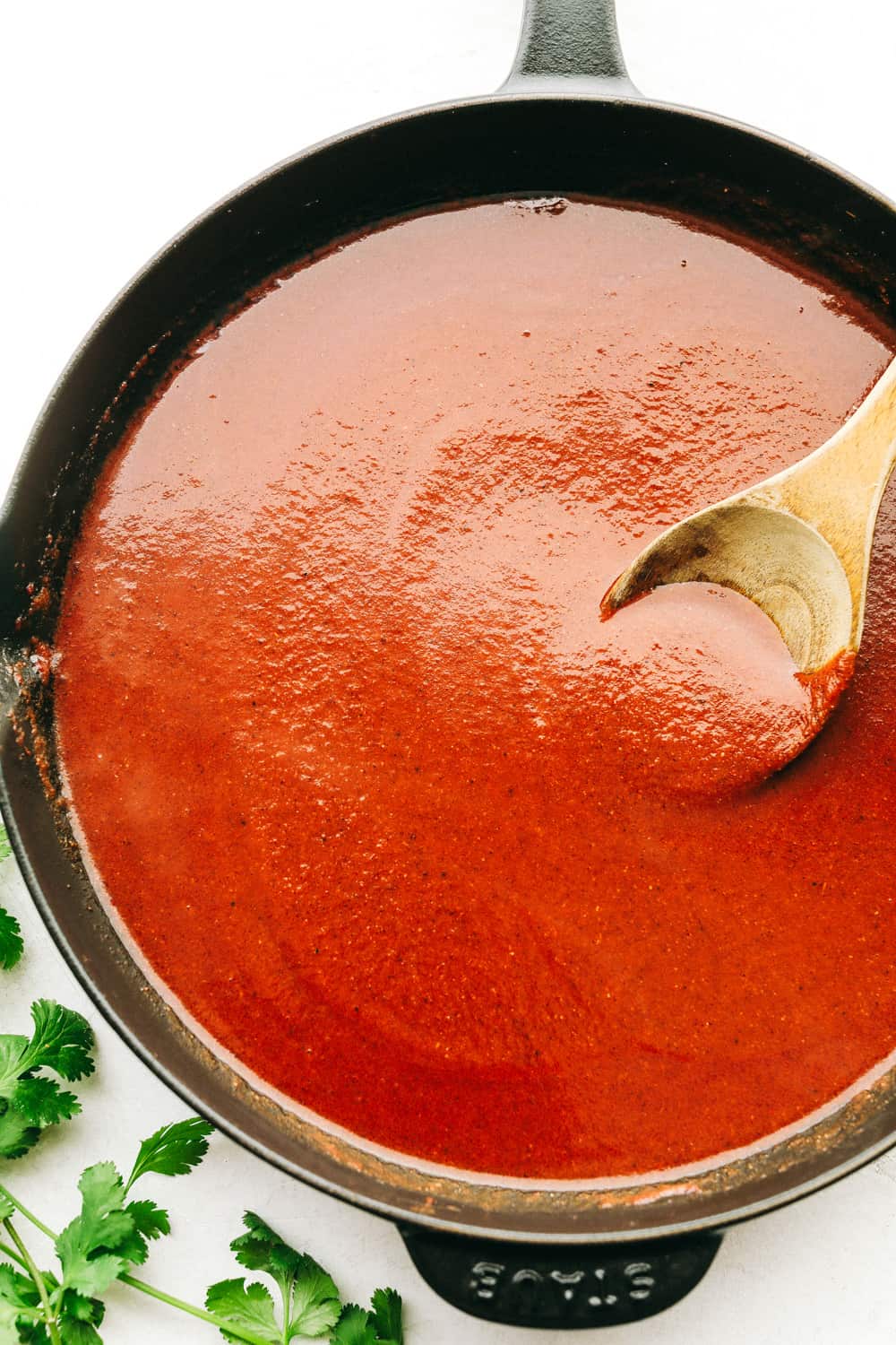 Rich, flavorful enchilada sauce in a skillet. 