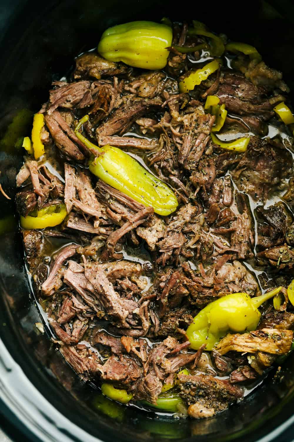 Slow cooker Italian beef with pepperoncini. 