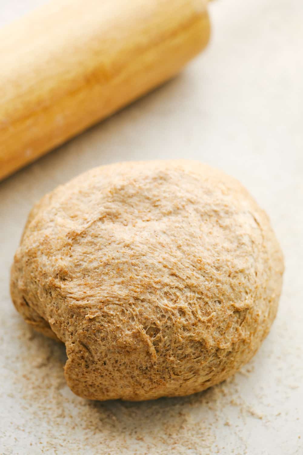 Ball of whole wheat pizza dough ready to roll out. 