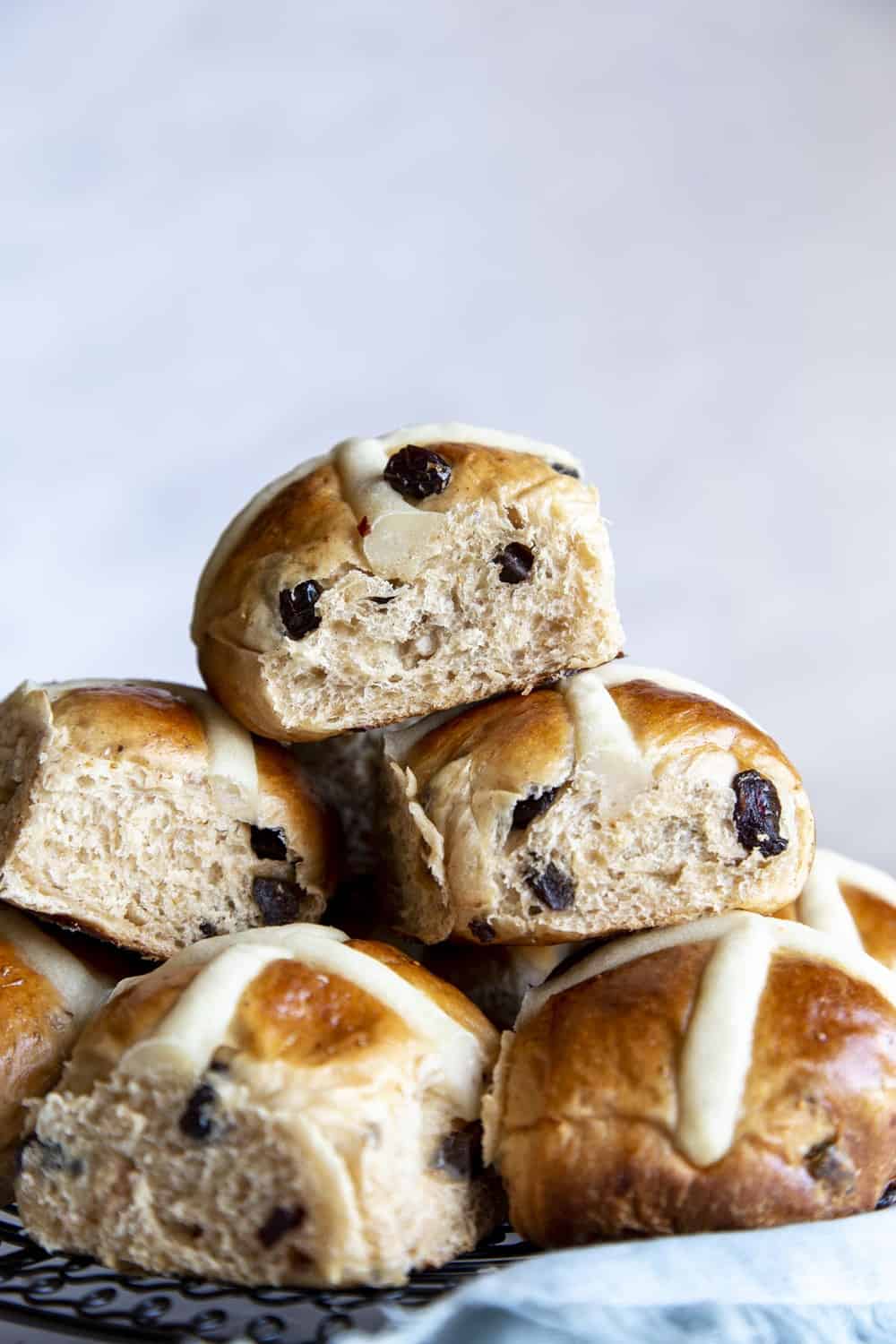 Soft fluffy Hot Cross Buns in a stack.