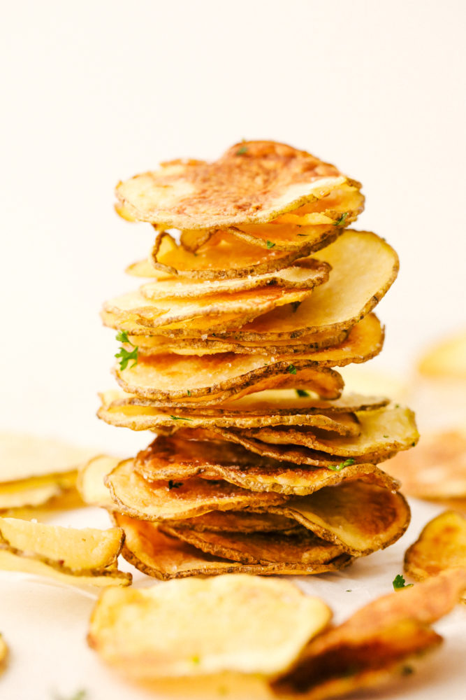 Air fryer potato chips stacked and ready to eat. 