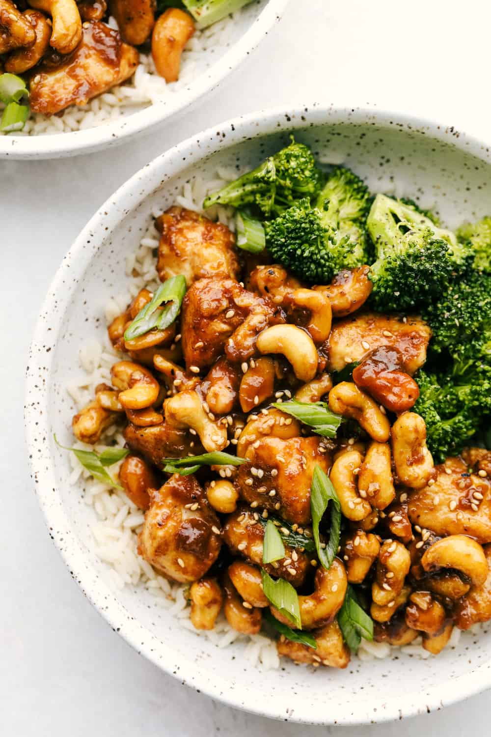 Cashew chicken on bed of rice with broccoli