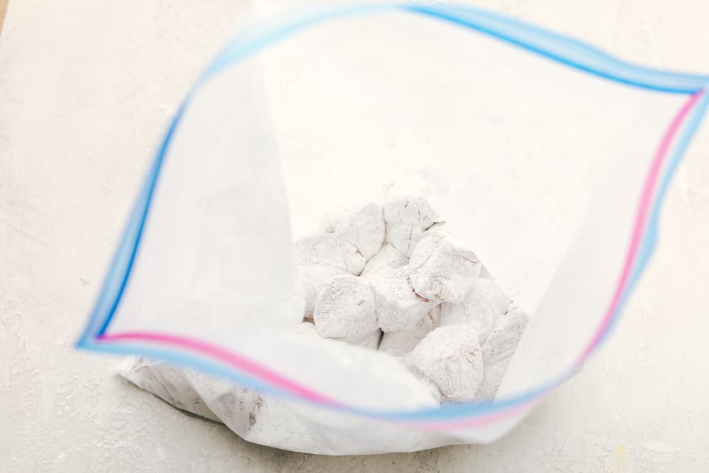 My easy Cashew Chicken recipe skips the breading and frying, but you still get that crispy tender chicken! It all comes together in my flavorful sauce! Pieces coated in cornstarch in a ziplock back.