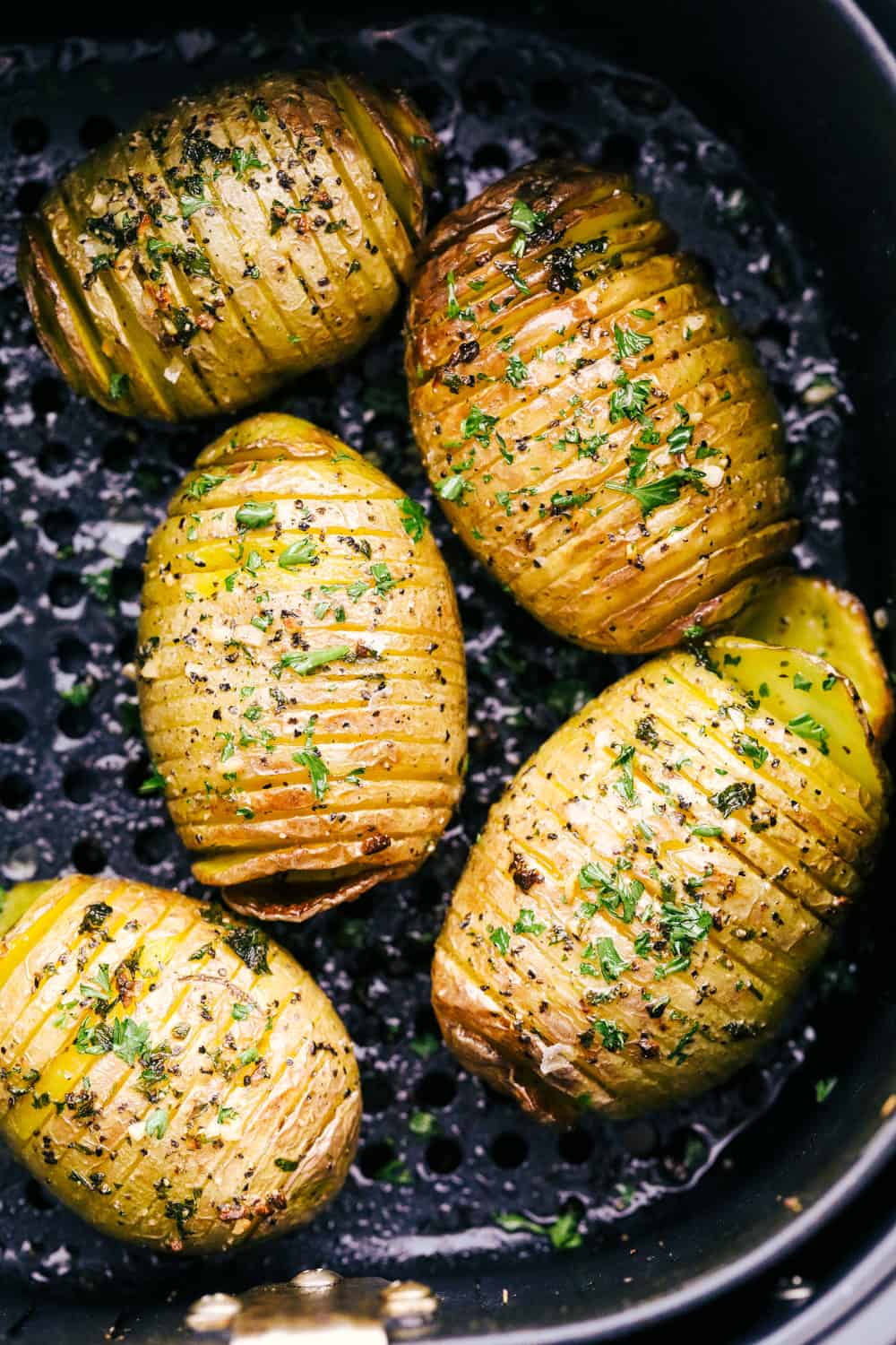 Hasselback potatoes in the air fryer with herbs and salt. 