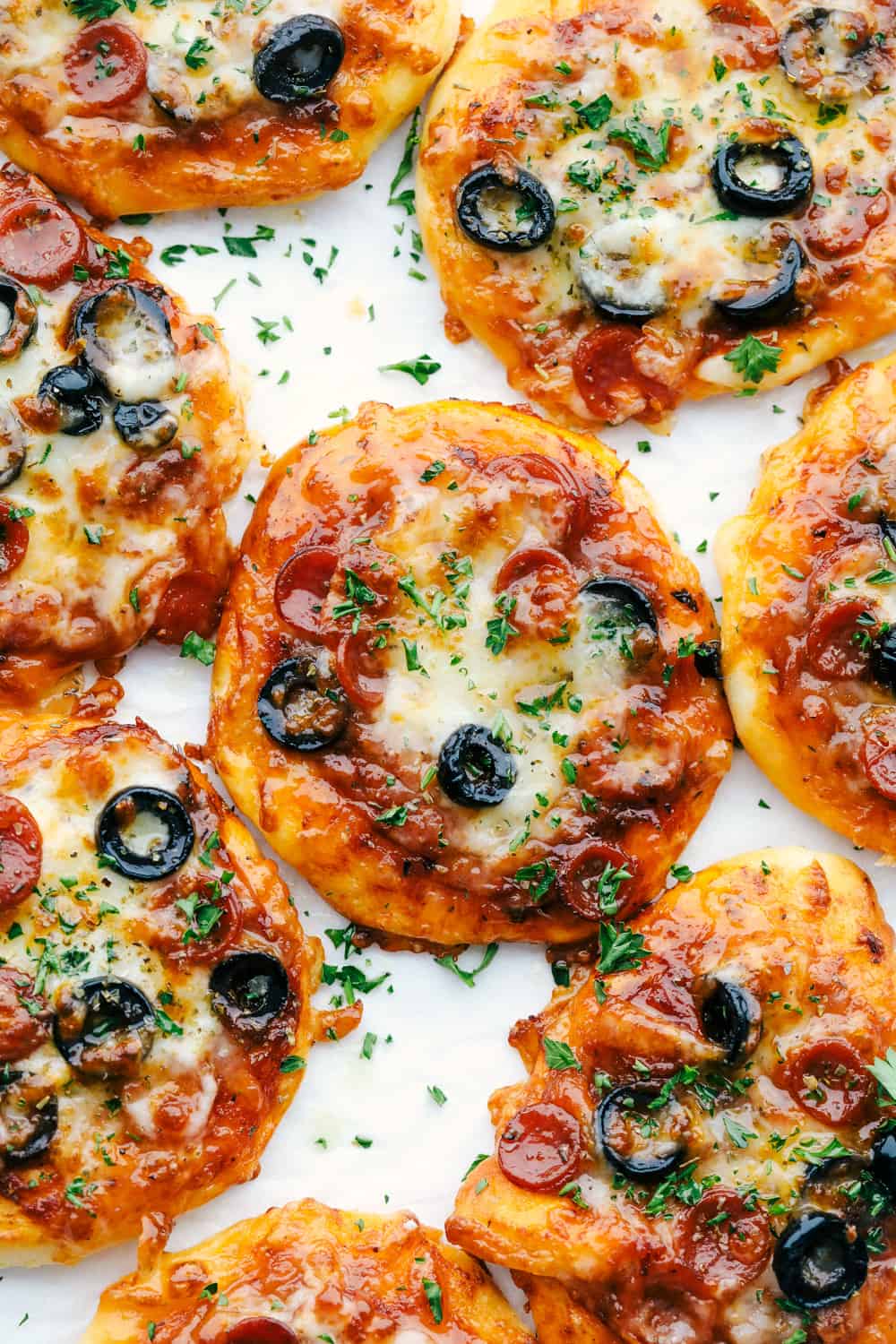 Air fryer biscuit pizzas with pepperoni and olives.