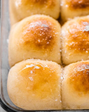 A close up of potato rolls in a pan.