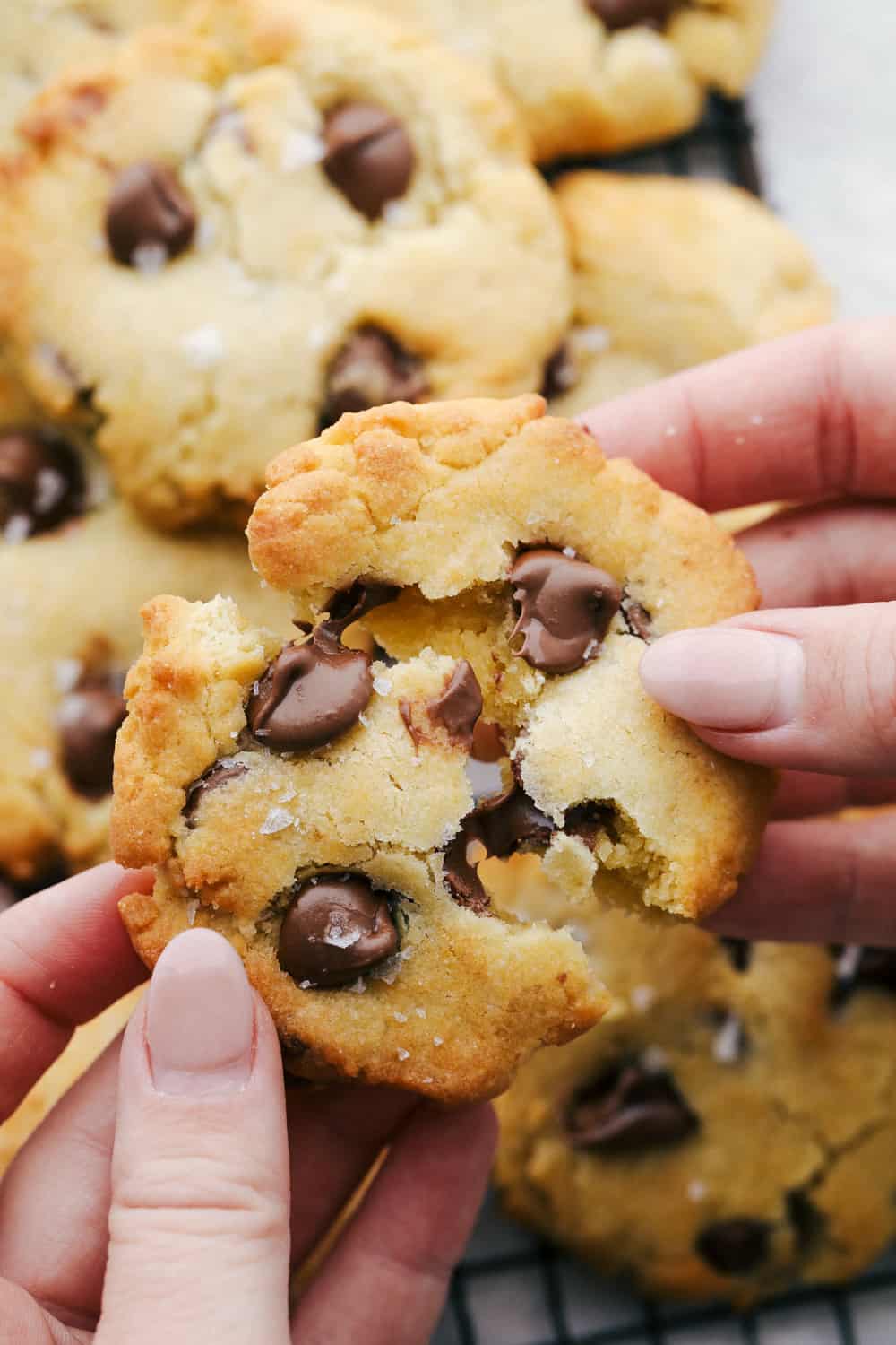 Breaking apart a cookie with melting chocolate. 