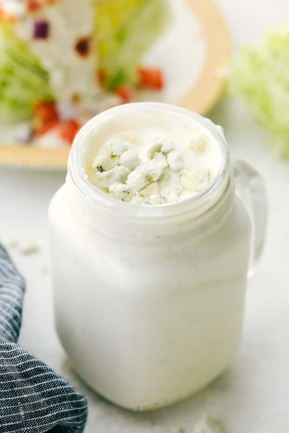 Creamy homemade blue cheese dressing in a jar. 