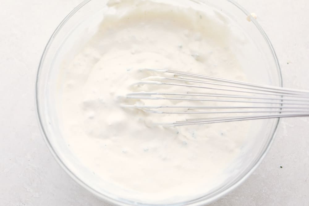 Whisking the dressing ingredients together. 
