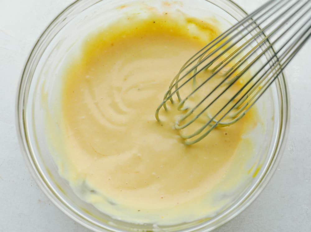 Whisking the ingredients for Chick-fil-A Sauce in a bowl. 