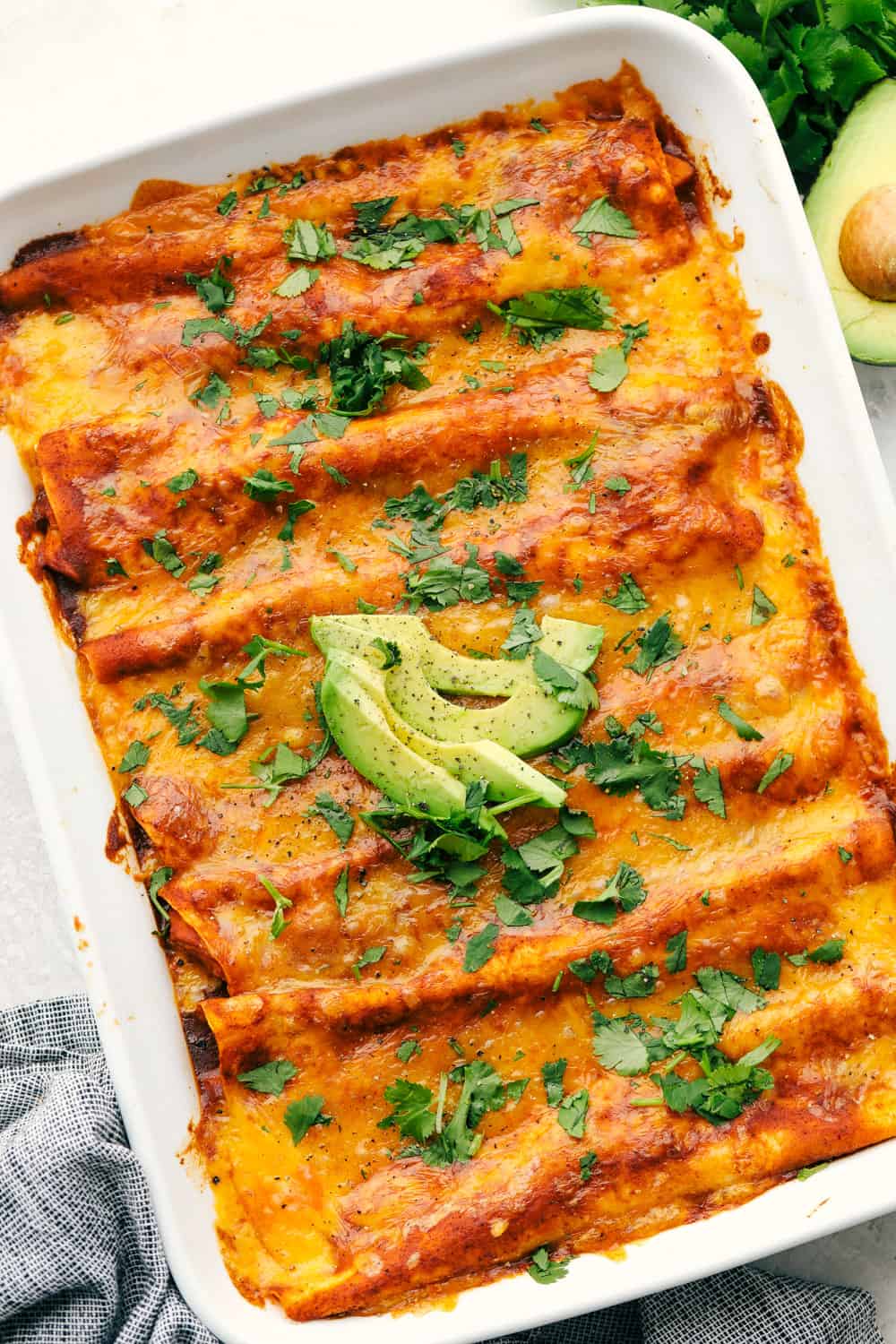 A pan of cheesy chicken enchiladas. 