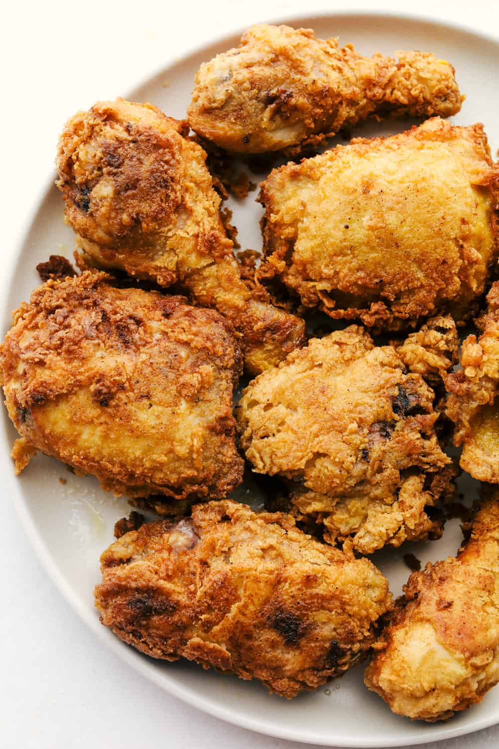 Perfectly golden fried chicken on a plate. 