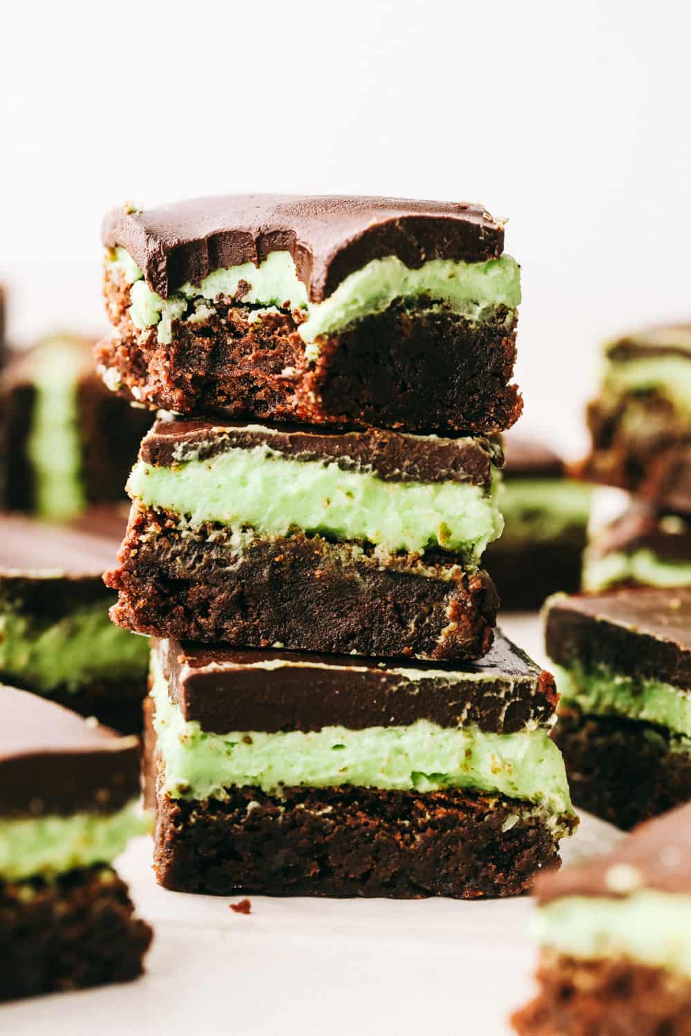 Mint brownies stacked on top of each other. 