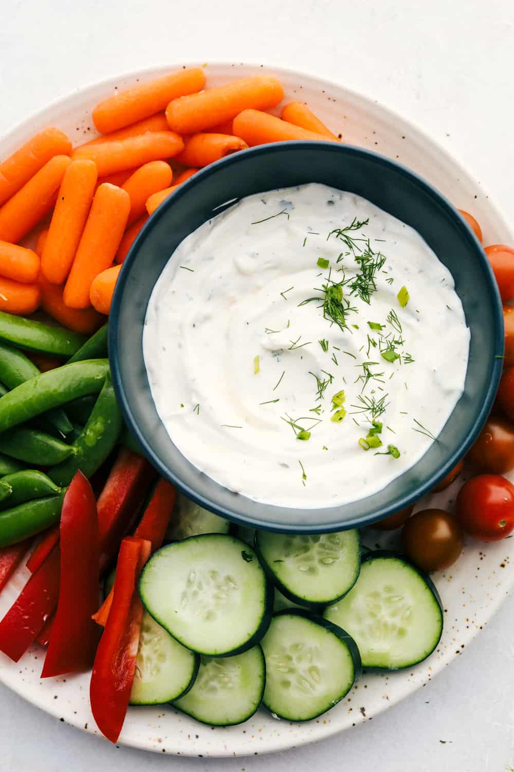 Vegetables with dip on a plate. 