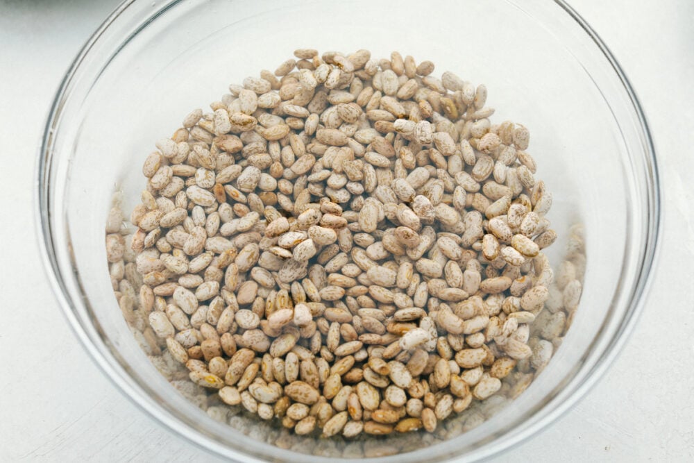 Soaking dried beans in a glass bowl. 