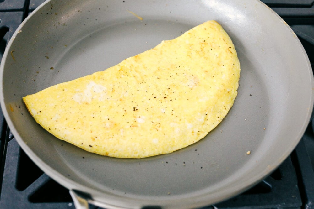 Cooked egg in a fry pan ready to use in sandwiches. 