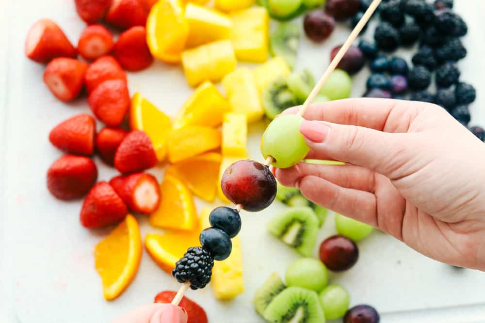 Assemble the fruit on wooden skewers. 