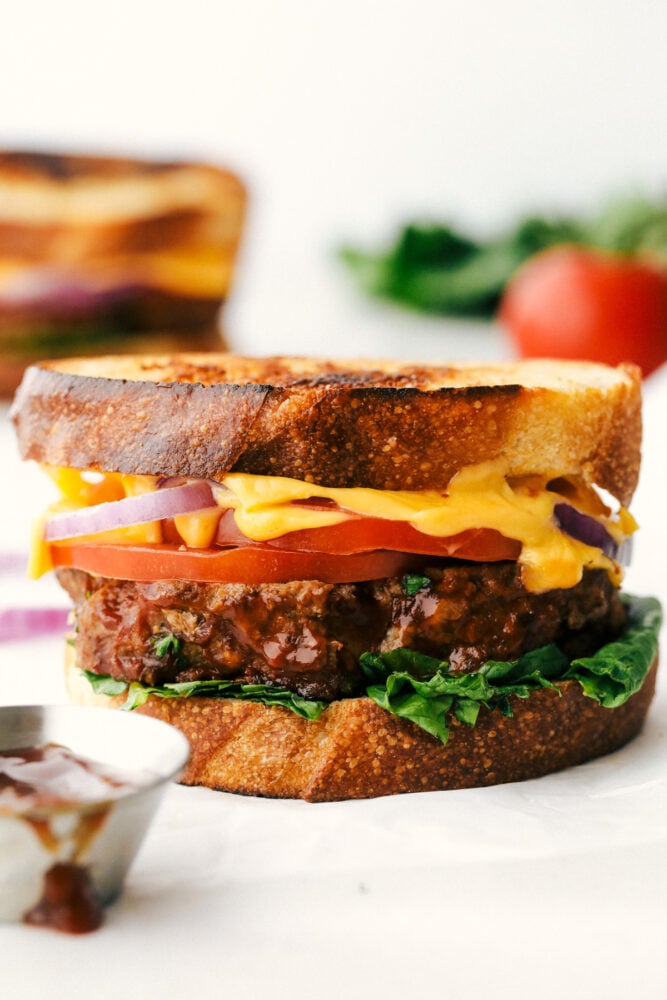 Grilled Meatloaf sandwich with cheese, tomato and lettuce. 