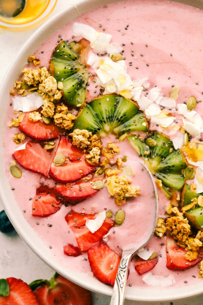 Spooning a bite of the smoothie bowl. 