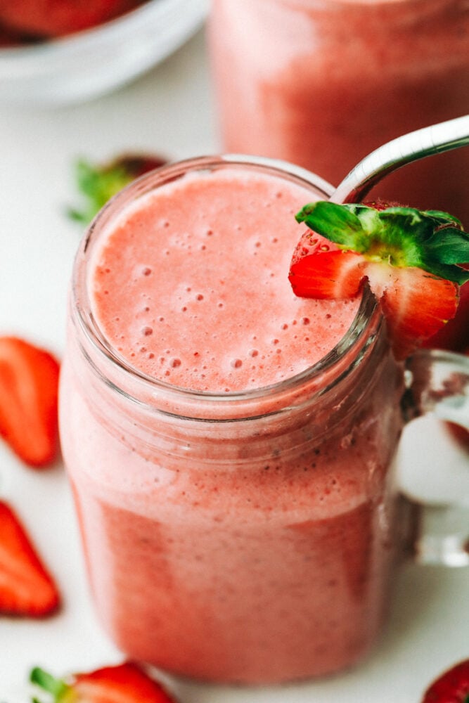 Strawberry smoothie in a jar and ready to drink. 