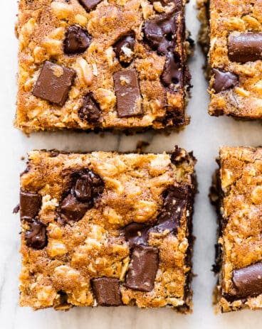 Oatmeal chocolate chip bars on a marble countertop.
