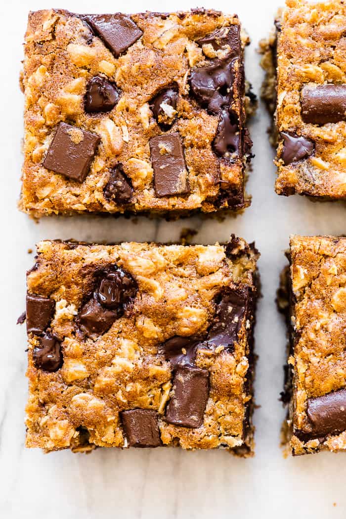 Oatmeal chocolate chip bars on a marble countertop.