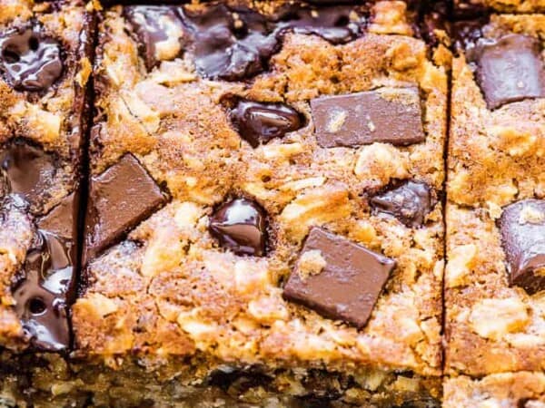 Oatmeal chocolate chip bars in a baking dish with a few missing.