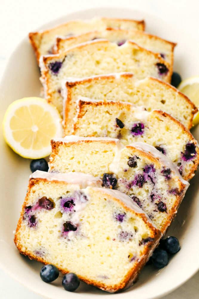 Slices of the cake with lemon glaze on a plate. 