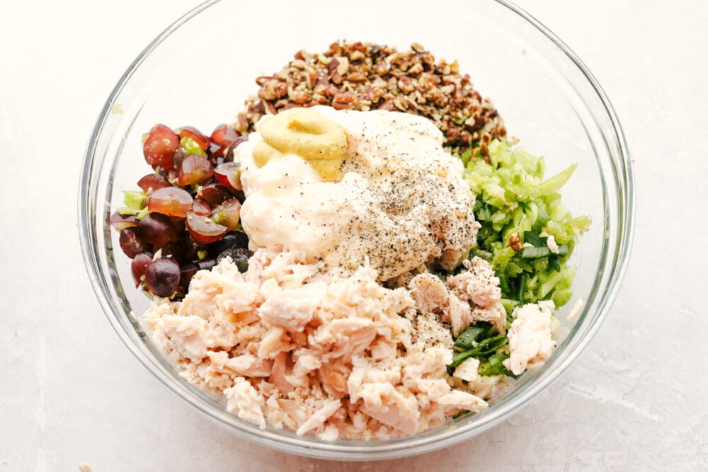 All the ingredients with the dressing ingredients in a bowl ready to stir. 