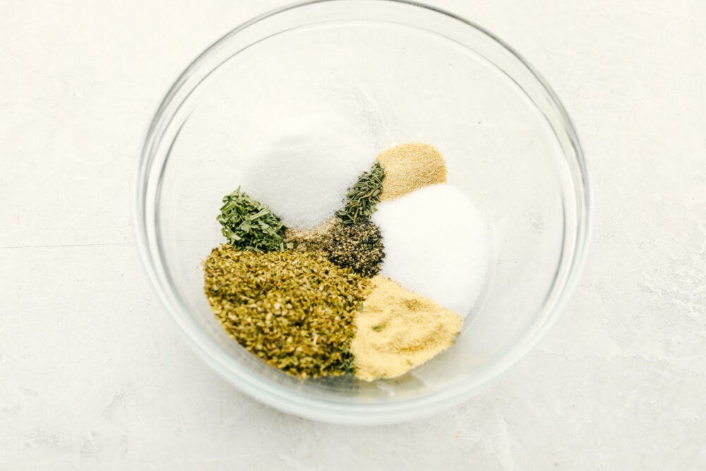 Seasonings separated in a glass bowl.