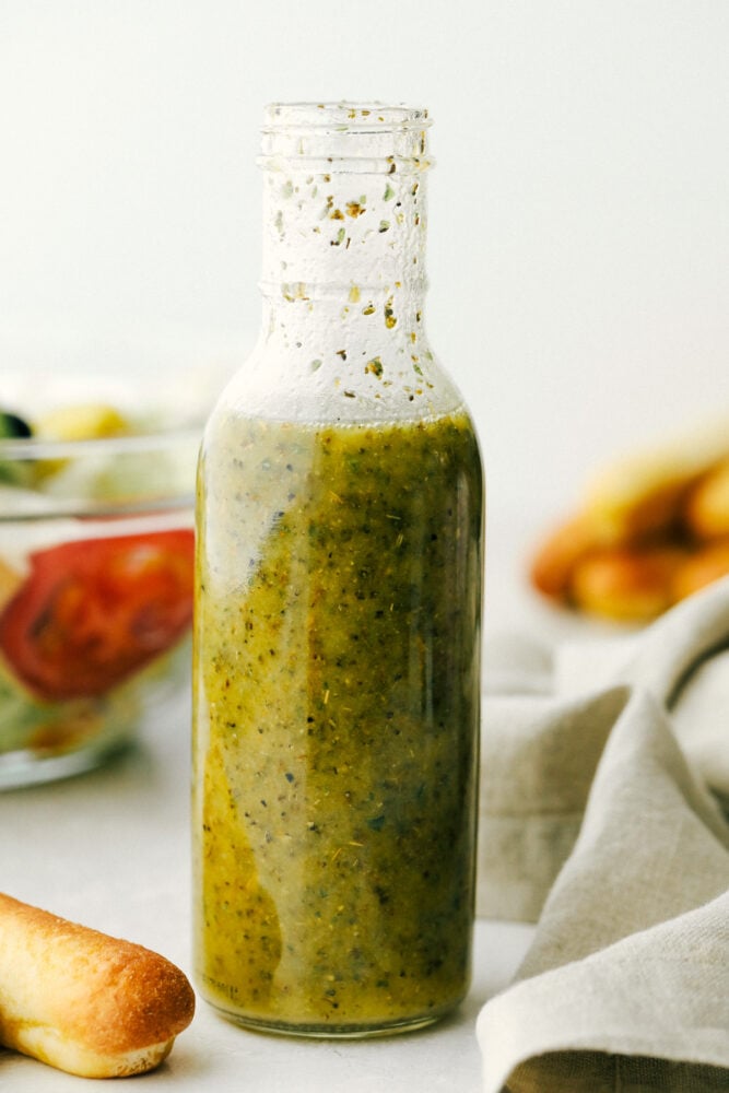 Olive garden salad dressing in a glass jar, 
