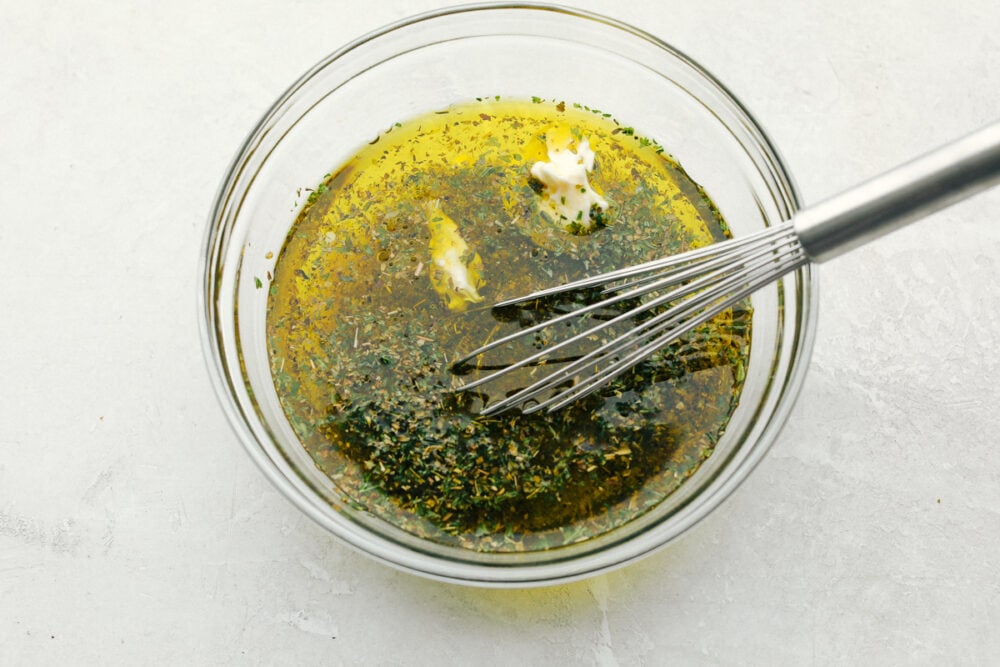 Mixing all the ingredients in a glass bowl with a whisk. 