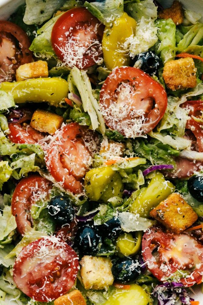 Copycat Olive Garden Salad is one of my all time favorite restaurant salads ever! And now you can have this bright zingy incredible salad at home! Up close picture of the salad all mixed together.