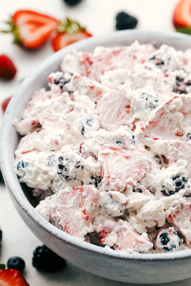 Berry cheesecake salad in a white bowl. 