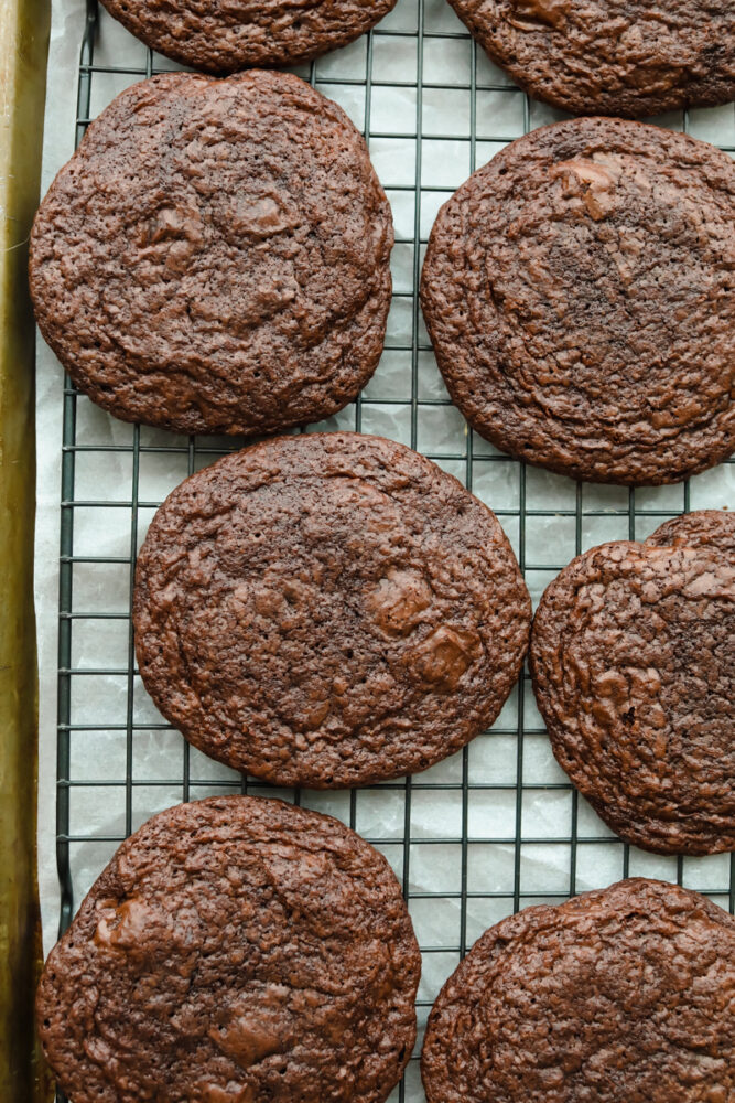 Baked brownie cookies on baking sheet.