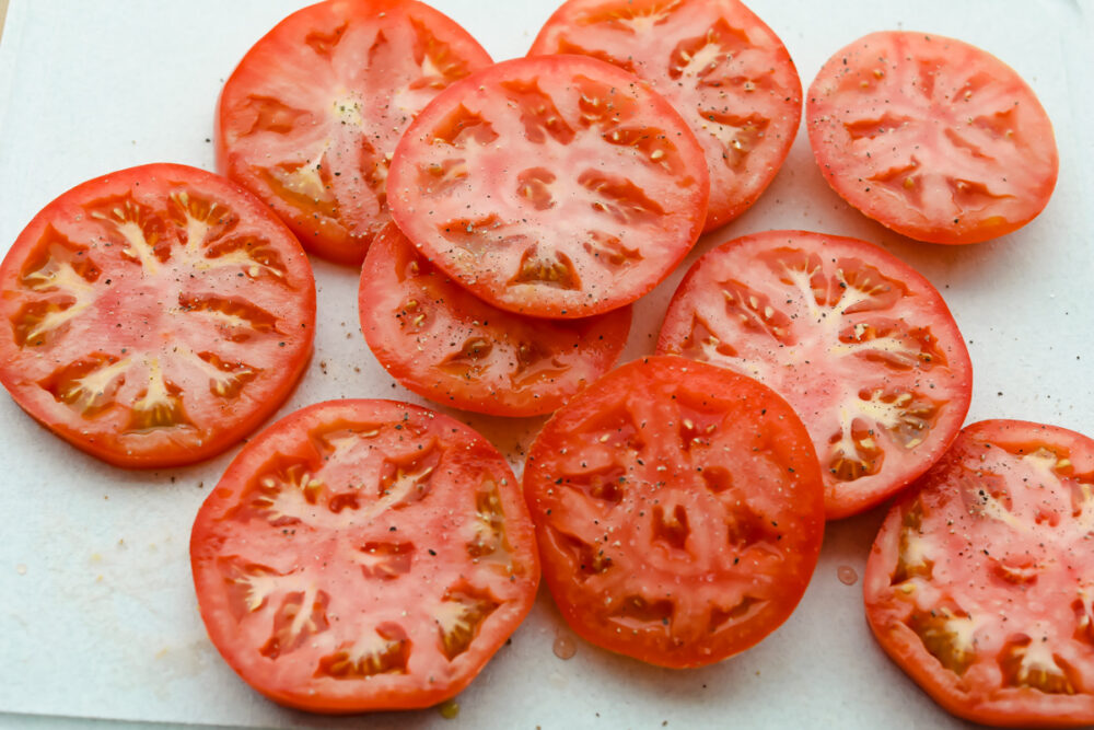 Raw tomatoes salted and peppered